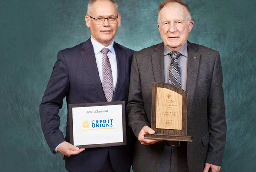 2018 Business Excellence Award sponsor Bernard Gillis of the Provincial Credit Union, left, presents Douglas MacKenzie, owner of Dr. John M. Gillis Memorial Lodge, with the 2018 Business Excellence Award. The annual award ceremony took place earlier this month in St. Peter’s Bay.
