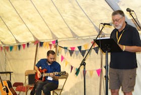 Bob Jensen, right, performs his spoken word poetry at the FolkEast Festival in Suffolk, England. He was joined by London-based guitarist/songwriter Jake Morley, who provided musical accompaniment.