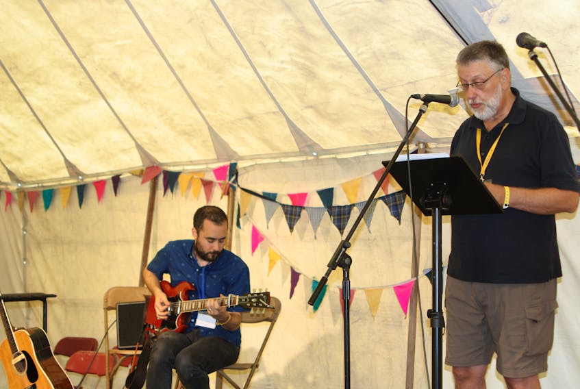 Bob Jensen, right, performs his spoken word poetry at the FolkEast Festival in Suffolk, England. He was joined by London-based guitarist/songwriter Jake Morley, who provided musical accompaniment.