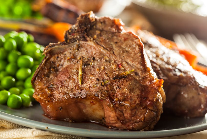 These lamb chops are served with peas and carrots for a delicious meal. When considering cooking methods, braising is a good way to cook tasty lamb shoulder chops.