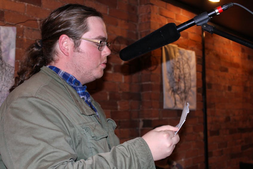 Chris Bailey reads poetry included in his upcoming book, “What Your Hands Have Done,” at the P.E.I. Writer’s Guild Open Mic June 14 at Receiver Coffee in Charlottetown.