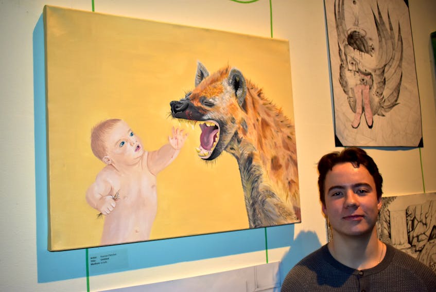 Holland College student Keenan Fletcher presents his untitled artwork at the Confederation Centre of Arts during the School of Visual Arts showcase on March 29. Fletcher’s painting is based on the showcase theme, the art of looking sideways.