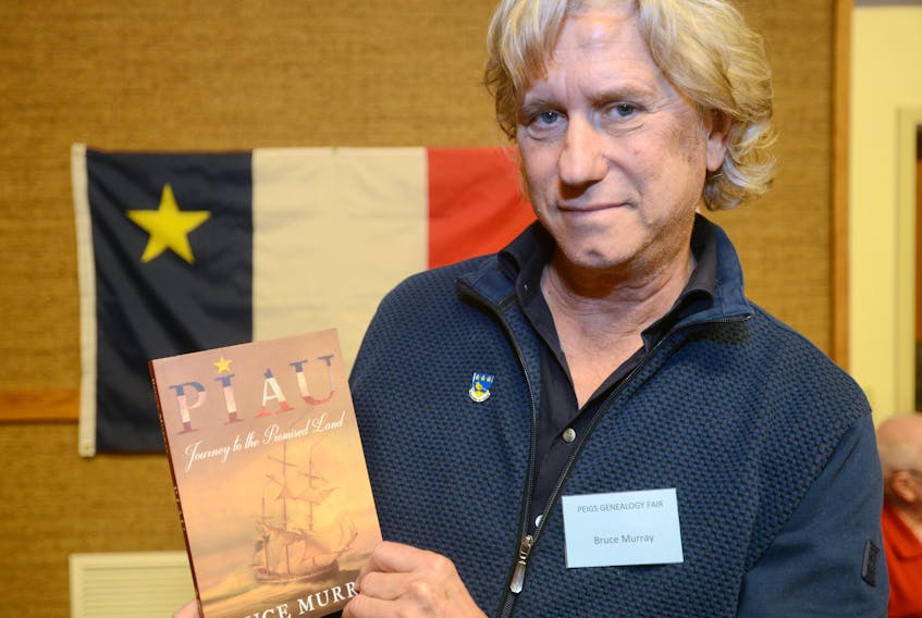 Bruce Murray holds a copy of his historical novel, “Piau: Journey to the Promised Land”, which details the life of Murray’s direct ancestor, Pierre Belliveau, who led a group of Acadians into exile in order to escape the expulsion. Murray spoke about his ancestry and the importance of preserving Acadian history during the recent P.E.I. Genealogy Fair. The foreword of Murray’s book is written by his sister, well-known Canadian singer Anne Murray, in which she says the stories of Belliveau were an important part of the family’s folklore.