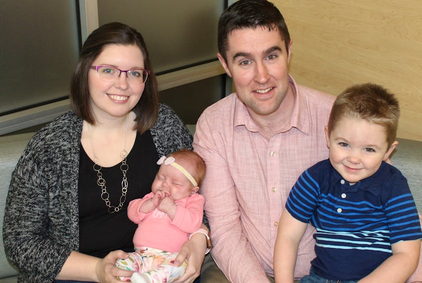 Ashley and Kyle Ferguson, shown with son, Owen, and daughter Olivia, are thankful to the QEH’s NICU staff and commend the volunteer work of the Wo-He-Lo Club.