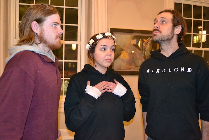 Cast members Dylan Gaudet, left, Charlotte Robertson and Guy Brun appear in a rehearsal scene from “A Most Pleasant Comedy of Mucedorus”. The play continues today and tomorrow, 7:30 p.m., in the Faculty Lounge of UPEI’s Main Building.