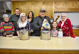 Ready to help out with preparations for a free Christmas Day meal are, from left, Peggy and Ted Peters, Tianna, Joni, Preston and Makayla Murphy and Jean Hagen. More than 200 people, many of whom otherwise would have been dining alone, were treated to a meal last year and organizers are preparing for as many or more this year. Meals will be served at St Anthony’s Parish Hall in Woodstock from noon until close to 4 p.m. on Christmas Day.