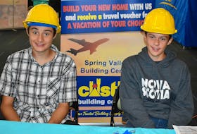 Declan Rockwell, from left, and Evan Aylward proudly represent Castle Spring Valley Building Centre at the Young Leaders Program Tradeshow.