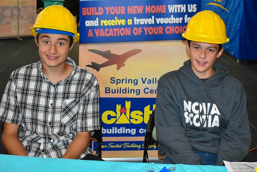 Declan Rockwell, from left, and Evan Aylward proudly represent Castle Spring Valley Building Centre at the Young Leaders Program Tradeshow.