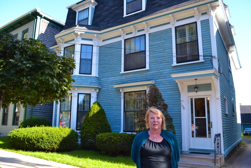 Sara Underwood stands in front of 108 Prince St., Charlottetown where Doris Loft, a British Home Child, lived in the 1900s. In the 1921 census, she was described as a daughter of William and Belle Wilmore.