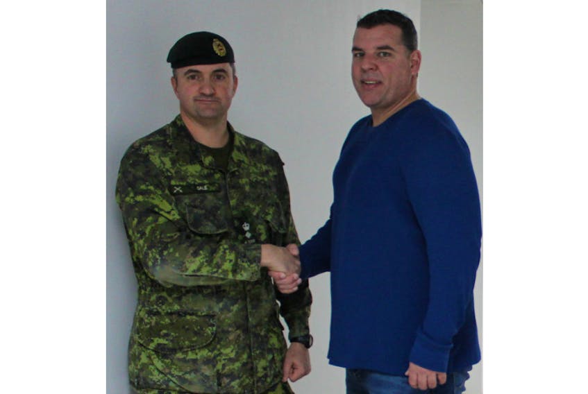 Adam Binkley, eight, executive director of the Summerside Boys and Girls Club, thanks Lt.-Col. Jason Gale for the work done at the club through Exercise NIHILO SAPPER 2018.