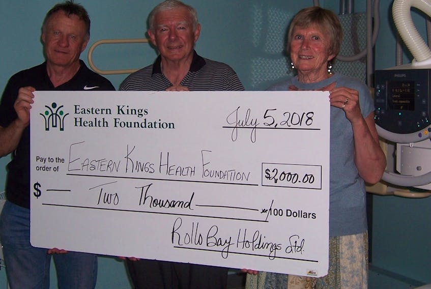 Rollo Bay Holdings Ltd. co-owners, Ray and Alvin Keenan have pledged $10,000 to the People You Know, Care You Can trust campaign. Ray Keenan, centre, presents the $2,000 installment for 2018 to Gerty Hoogerbrugge and Tommy Kickham, Eastern Kings Health Foundation directors.