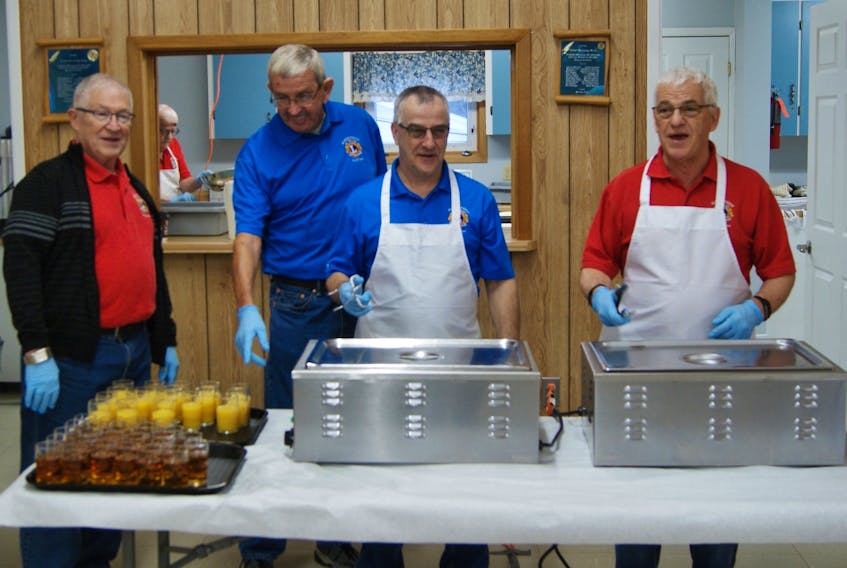 The Summerside Lions, including Bernard McKenna, left, Greg Deighan, Mike Arsenault and Andrew Gallant, get ready to welcome people to their successful pancake breakfast held earlier this spring. Over $1,500 was raised with all the proceeds going to Ronald McDonald house. Submitted