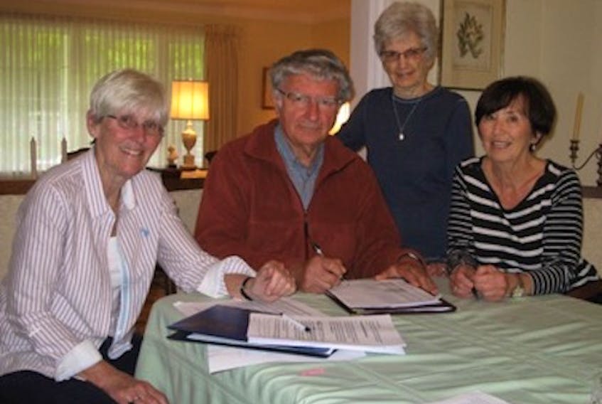 The executive committee of the Prince of Wales College alumni is to finalizing plans for the Friday, July 27 reunion at UPEI and Holland College. Some of the committee members are, from left, Nora Scales, committee president John Andrew, Barbara MacNevin and Dianne Anderson.
