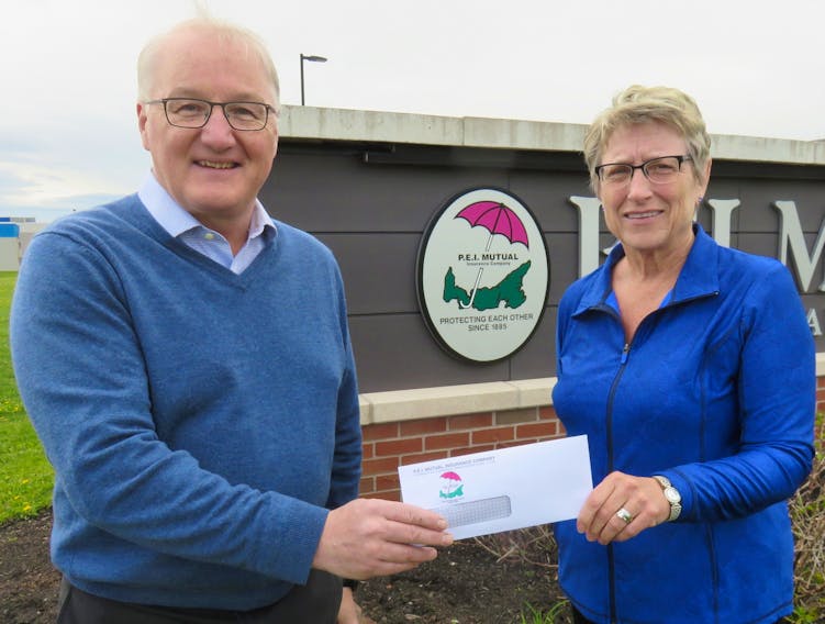 Blair Campbell, CEO of the P.E.I. Mutual Insurance Company of Summerside presents a cheque to provincial youth talent co-ordinator Jean Tingley. As platinum sponsor of the P.E.I. Association of Exhibitions for the past 20 years, P.E.I. Mutual Insurance has donated $322,000 to support the Youth Talent Program and other projects at PEIAE fairs, festivals and exhibitions held each summer on the Island.