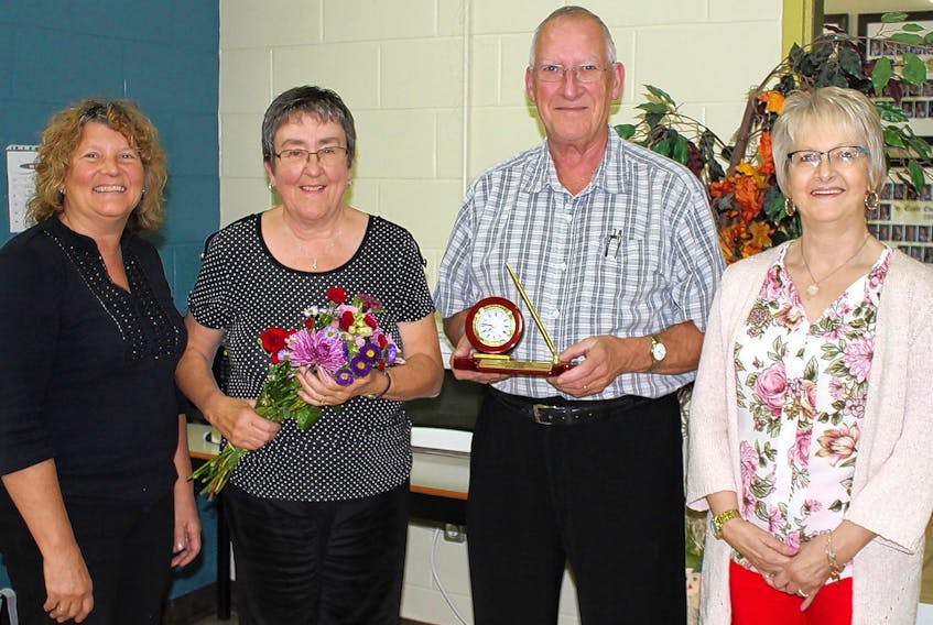 Darlene Arsenault, left, from Le Village des Sources l’Étoile Filante Co-op, and Melva Gallant, right, from Le Bel Âge Housing Co-op, help to recognize the accomplishments of Edmond and Zita Gallant of St. Timothy as they receive the 2017 Acadian Order of Merit. (Submitted photo)