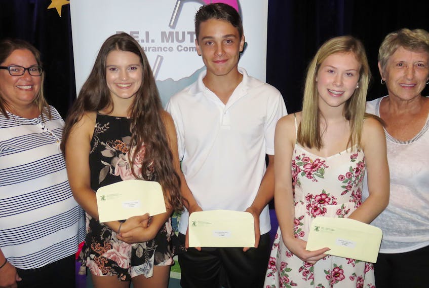 Joselyn Jelley of Howlan, second left, is the 2018 winner of the Abram-Village Festival acadien Youth Talent Competition. She received $300 from P.E.I. Mutual Insurance representative Jane MacLaurin, left. Finishing second and receiving $150 was Jasper McCormack, Tyne Valley, with Jensen Wood, Charlottetown, receiving $75 for third place. Congratulating the winners is provincial talent co-ordinator Jean Tingley. Jelley will represent the Festival acadien at the provincial finals on Friday, along with other young Islanders.