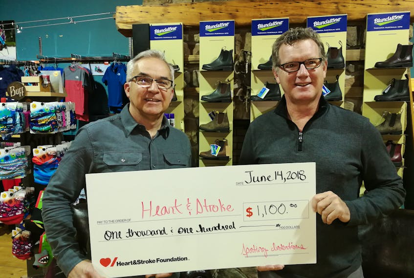Peter Norton, Heart & Stroke P.E.I. advisory board chairman, accepts a cheque for $1,100 from Wes Slauenwhite, general manager of Sporting Intentions. The cheque represents proceeds from the 11th annual Spring Run-Off, held recently in rainy but mild weather conditions. The event is a long-time favourite among runners wanting to test their legs after a long winter. This year saw 66 participants. - Submitted photo