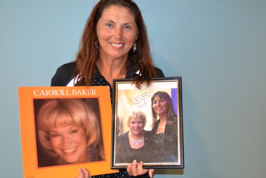 Fan Jolee Patkai shows some of her Carroll Baker memorabilia. The P.E.I. singer-songwriter has been invited to sing two songs with Baker at her Sept. 22 concert.
