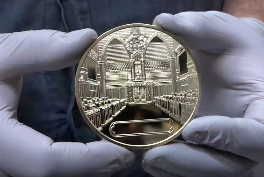 A screenshot of a Royal Canadian Mint video showing the Senate Canada 150 medal.
