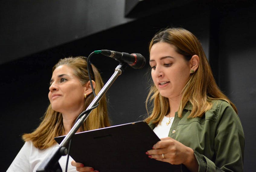 Karina Navarro and her daughter Mariana Navarro lost a mother and grandmother in the Swissair crash. They're shown reading from a plaque of appreciation they presented to emergency responders and local residents at Blandford Community Centre on Sunday.