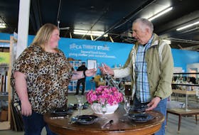 Kayla MacPherson, left, and Garry Smith adjust a dinner set display at the new SPCA Thrift Store, now open on Welton Street, Sydney. MacPherson is a store employee, while Smith is a volunteer. The thrift store is open Tuesday to Friday from 10 a.m. until 6 p.m., Saturday from 10 a.m. until 4 p.m., and Sunday from noon until 5 p.m. Proceeds from sales support animals under the SPCA care. The thrift store is also accepting donations and is in search of new volunteers.