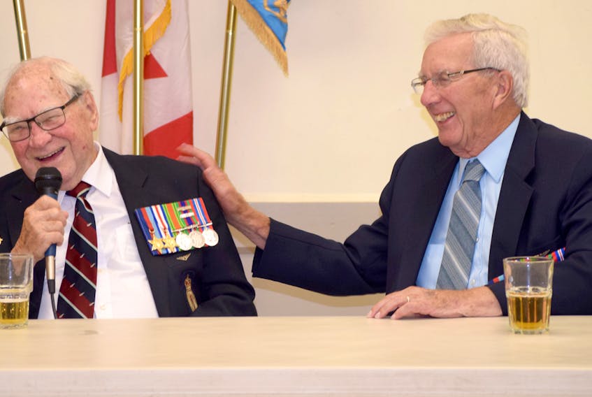 Second World War veterans Henry "Chick" Hewett, left, of Oshawa, Ont., and Roy Morrison of Truro Heights shared a happy moment during their reunion at the Air Force Association's 102 Wing in Truro last October. Hewett died on Wednesday. He was 96.