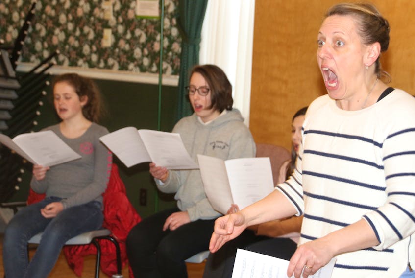 First Baptist Girls' Choir director Bette Pring leads the girls in song during a recent practice. The choir's annual gala takes place March 25.