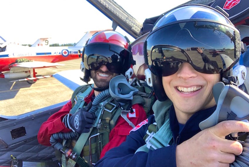 Cpl. Matthew MacKenzie, right, is seen with Pierre-Marc Deschênes, pilot of the Snowbirds #7 jet, which MacKenzie services as part of his role as an Aircraft Structures Technician.