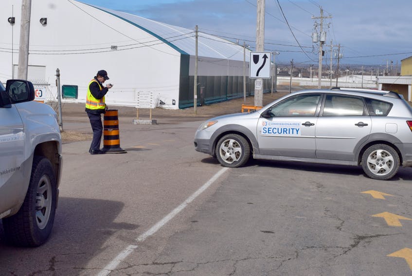 A commissionaire is seen checking a vehicle in at the NSPE grounds in Bible Hill. The 24/7 security is intended as a temporary measure during the transition period since being taken over by the provincial government.
