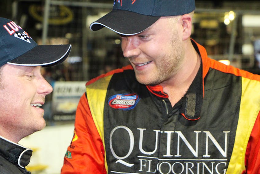Dylan Blenkhorn, right, and Donald Chisholm chat following their close battle for the Lucas Oil 150 checkered-flag.