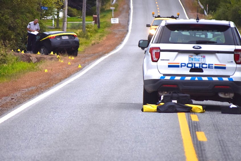 An RCMP collision analyst is seen conducting an investigation into a single-vehicle accident on Highway 2 in Upper Economy on Wednesday afternoon. No fatalities were reported although the Bass River Fire Brigade did use the Jaws of Life to extract at least one occupant from the vehicle.