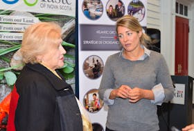Mélanie Joly, right, federal Minister of Tourism, Official Languages and La Francophonie, speaks with Colchester County Mayor Christine Blair following a funding announcement held Thursday in Masstown.