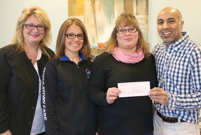 Funds raised through the Pink Ribbon Hockey Tournament were donated to the Nova Scotia Breast Cancer Foundation and the We Care About Cancer Fund-Colchester County. Taking part in the presentation were, from left, Darlene Holmes, cancer patient navigator at the Colchester-East Hants Health Centre; Karen Swan, ambulatory care patient care load, Ellie Shipley-Landry, founder and organizer of the tournament; and Ray Makkar, manager of ambulatory care services at the hospital.