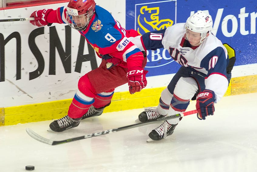 Mark Goudge/SaltWire Network
Team USA’s Tyler Madden (10) sweeps the puck away from Russia’s Alexander Zhabreyev (9) during first period action in a World Junior A Hockey Challenge semifinal game on Thursday at the RECC. The Americans rolled to a 5-0 victory to earn a spot in Saturday’s final.