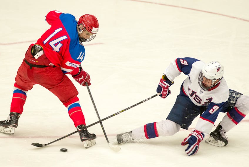 Russia’s Grigory Denisenko and USA’s Jack Drury go after the puck during semifinal action at the World Junior A Hockey Challenge in Truro. Mark Goudge/SaltWire Network