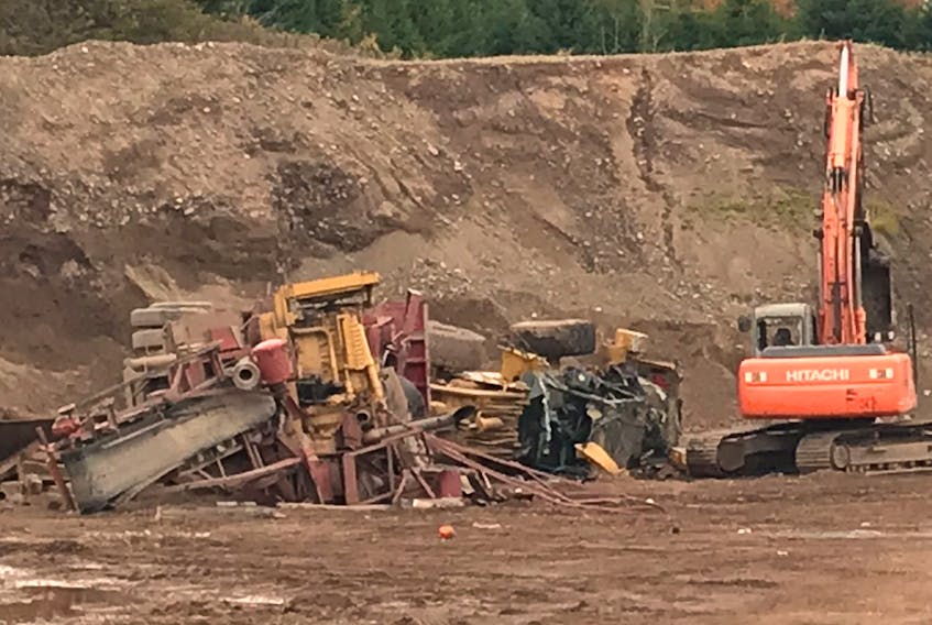 A weigh-scale, scale house and portable toilet were completely destroyed and heavy equipment was badly damaged late Sunday night at a gravel pit in Greenfield.