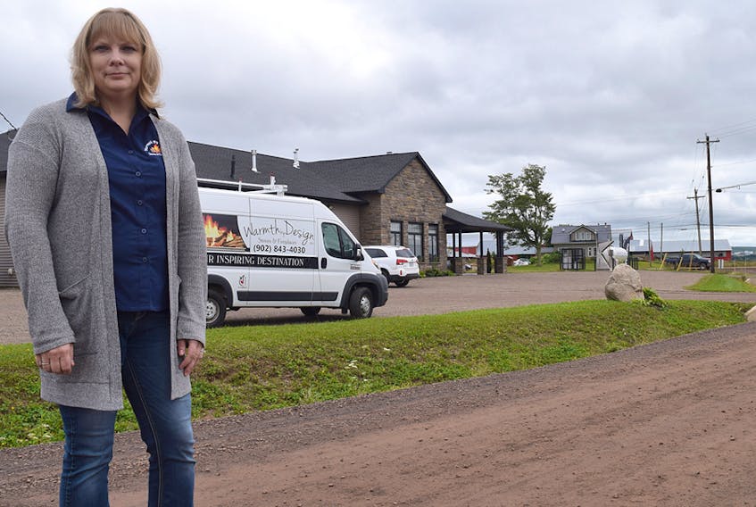 Trina Langille of Warmth by Design on Hub Centre Drive says she and other business owners are upset at dealing with dust and potholes from the unpaved road.