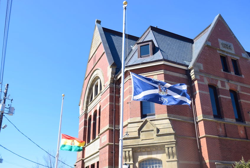 The flags were flying at half staff at the Truro Town Hall on Wednesday in mourning for Truro fire fighter Skyler Blackie who died Wednesday morning from injuries sustained during a fire fighting training exercise in Waverly on March 9.