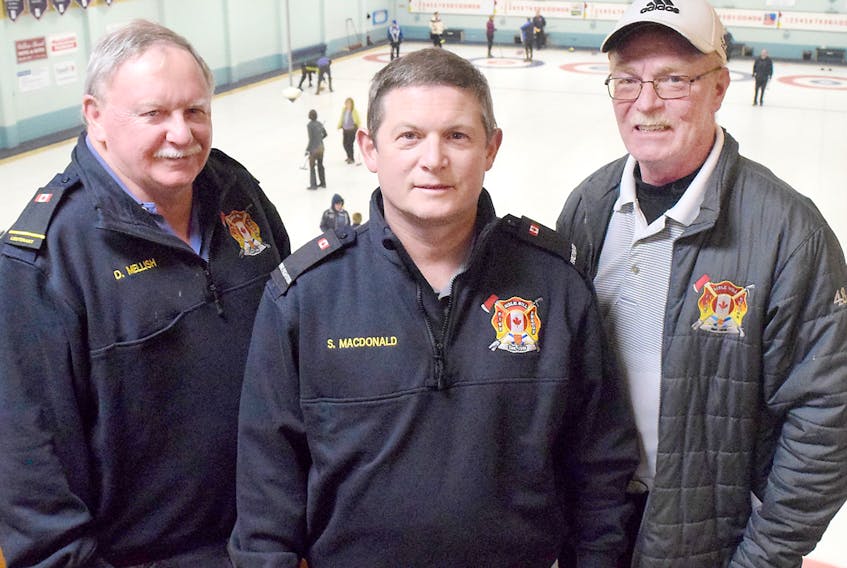 The Maritime Firefighters Association curling championship will be played this weekend at the Truro Curling Club. Looking after the details of the event are host committee members, from left, Dwane Mellish, Scott MacDonald and Eric Johnson of the Bible Hill Fire Brigade.