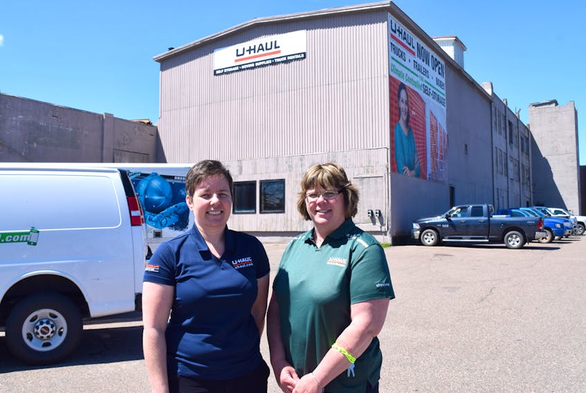 The U-Haul Company, which recently purchased the former Lewis Hat Factory building in Truro, is planning to create several floors of self-storage units as well as renting moving vehicles from the location. Pictured above from left are Tracey Higgs, Atlantic Canada president, and Michele Rees, general manager of the new Truro location.