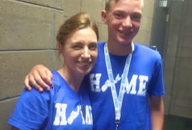 Volunteer Heather Boyd with her son Liam, who served as a timer at the Down Syndrome World Swimming Championships held at the Rath Eastlink Community Centre in Truro last July.
