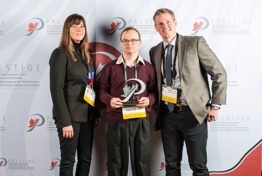 The Rath Eastlink Community Centre was recently honoured with in Ottawa with the Canadian Sport Tourism Alliance’s Sport Event Legacy of the Year Award for successfully hosting last year’s Down Syndrome World Swimming Championships. Pictured from left are Kendra Reay of Connect On Campus, who presented the award to Truro swimmer Matthew Hunter and RECC general manager Matt Moore.