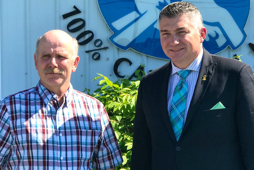 Gerrit Damsteegt, left, a farmer and chair of the Dairy Farmers of Nova Scotia, speaks with federal Conservative MP James Bezan in Lower Truro this week.