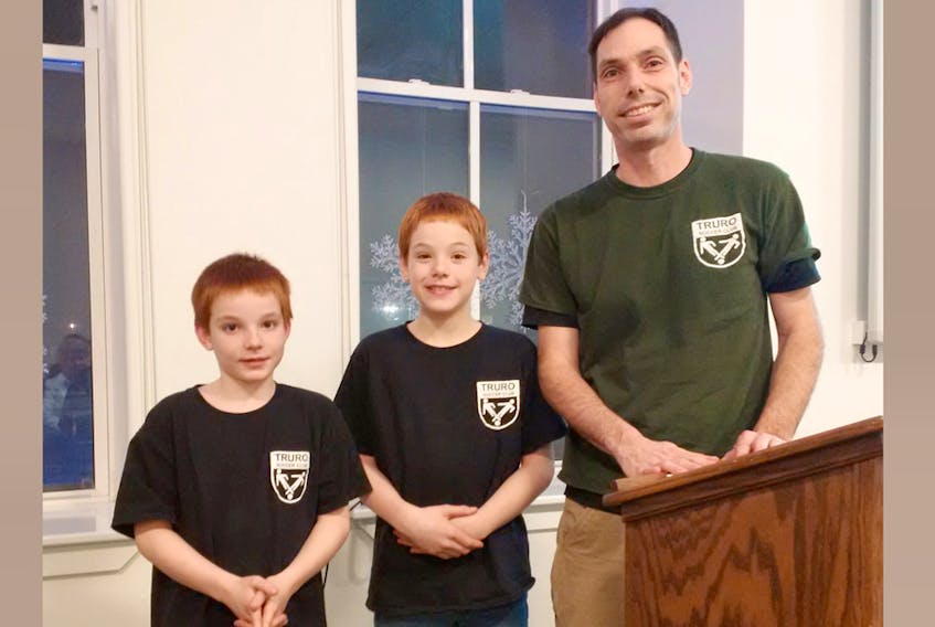 Gregg Morris, right, of the Truro Soccer Club was on hand during the presentation of the recent community health board wellness grants. Seen with him are his sons, Montgomery, 7, and Xavier, 9.