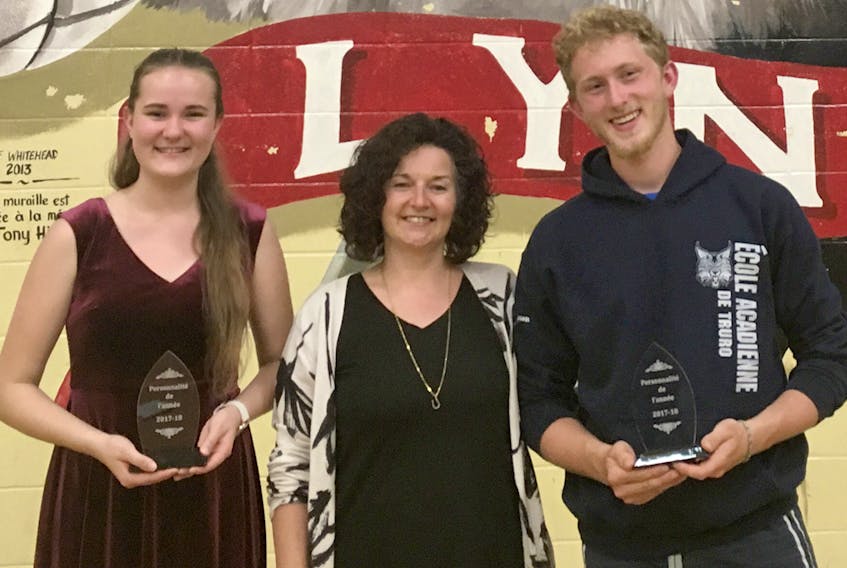 Violette Drouin and Daniel Sampson were named students of the year at Ecole acadienne de Truro. Presenting the duo with their awards is vice-principal Lynne Theriault.