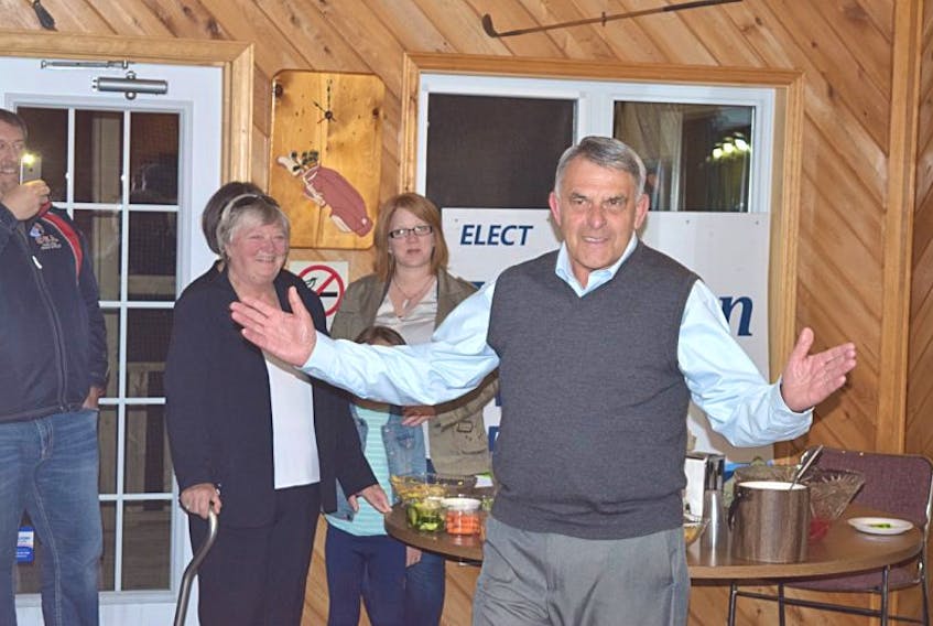 Larry Harrison arrives to be greeted by supporters Tuesday night after results showed the incumbent Colchester-Musquodoboit Valley MLA has been returned for another term.