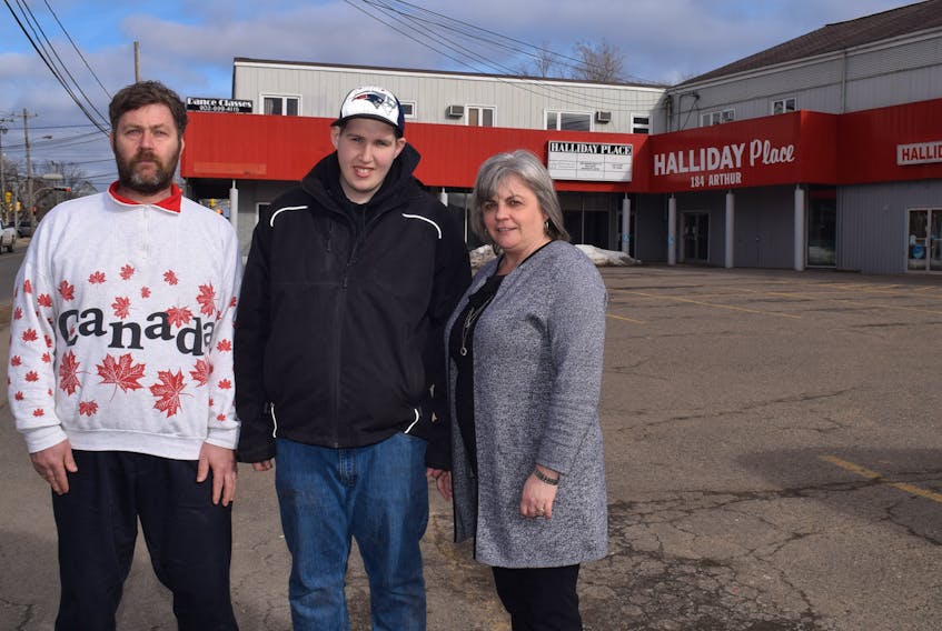 Clients and staff alike at the Colchester Community Workshops are eager to take over possession of the Halliday building on Arthur Street in Truro after it was recently purchased by the organization. From left, clients Danny Black and Nathan Legere and workshops executive director Susan McCallum.