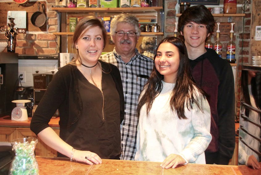 Some of the people you might see behind the counter at Joe’s Fair Trade Café are, from left, Nikita Seguin, Joe Pinto, Sofia Yon and Michael Pinto.
