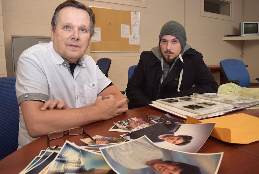 Tom Cook, left, and his son Mike, look through a family photo album at pictures of Cook’s eldest son, Troy, who disappeared in 1998 at age 19. Cook refuses to give up the hunt for some clue that will lead to answers about Troy’s disappearance.
HARRY SULLIVAN – TRURO DAILY NEWS