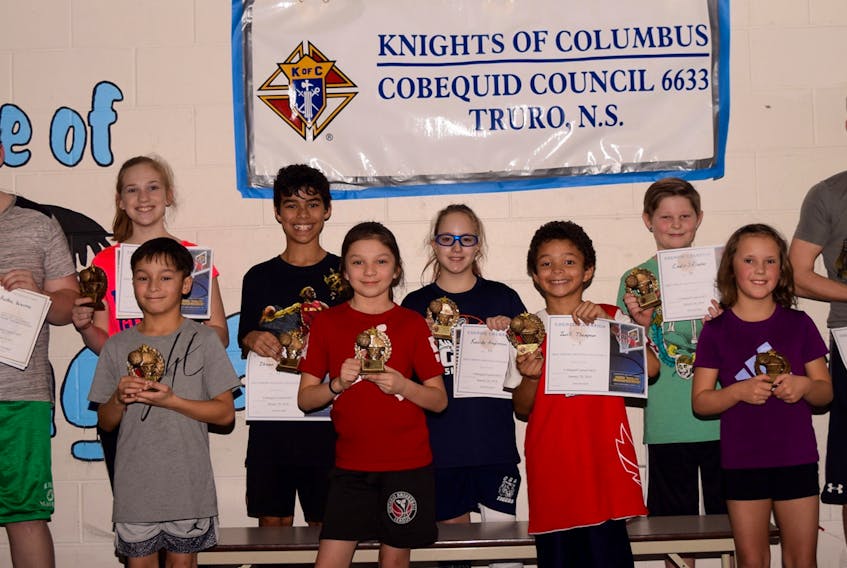 Winners from each age bracket of the K of C free throw competition were awarded trophies, and are advancing to the provincial championships, which will be held at Redcliff Middle School in April. First place winners were, front row, from left, Christopher DeCoste, Jai Sylliboy, Javell Thompson and Charley Thompson. Second row, Austin Warren, Paige MacPhee, Jhevan Paris, Kassidy Anderson, Cadin Skinner and Avery MacPhee.